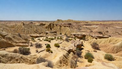 Dry arid badlands and sparse scrub vegetation of the Tabernas Desert in Andalusia Spain